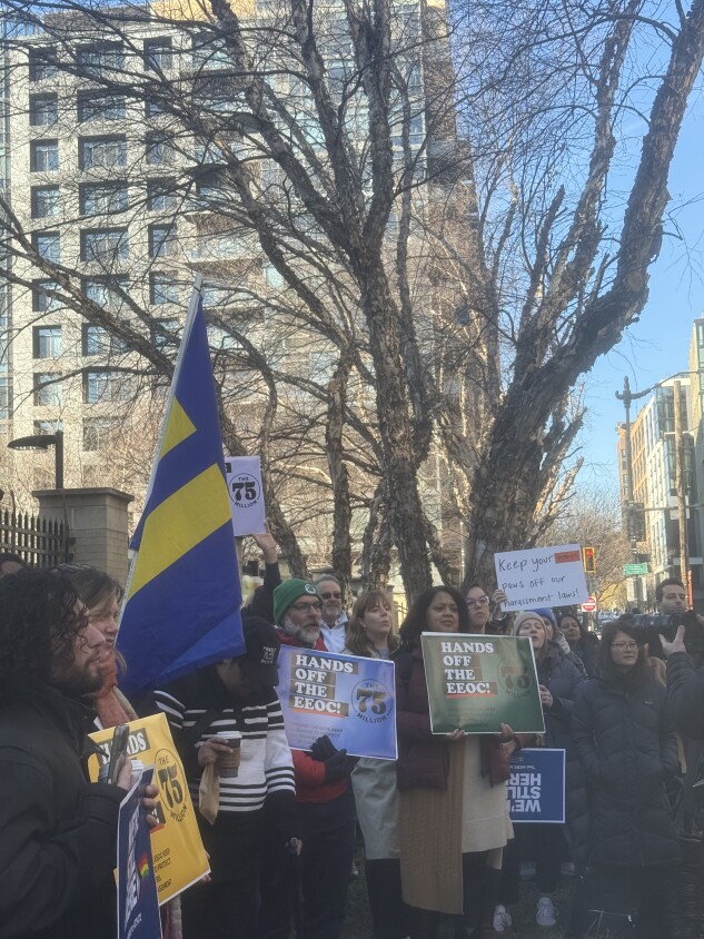 Civil rights advocates gather outside the Equal Employment Opportunity Commission building on Jan. 22