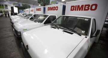 Electric delivery trucks sit inside a Grupo Bimbo sales center.
