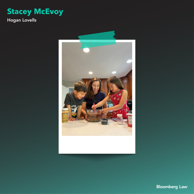 Stacey McEvoy of Hogan Lovells and children baking.