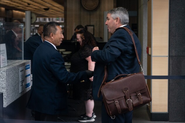 William "Bill" P. Ramey III and Susan Kalra enter the San Francisco federal court on Sept. 19, 2024, to face a sanctions hearing over his practice's patent litigation in California.