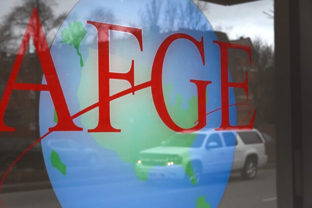 A sign is painted on the window of the American Federation of Government Employees offices on Jan. 20, 2023, in Chicago. The union has filed a legal challenged to the possible layoffs