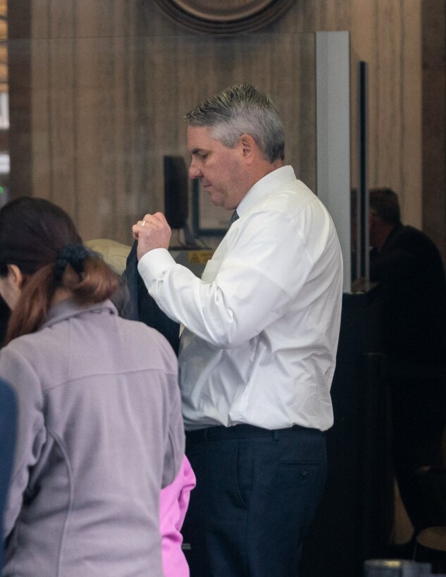 William Ramey enters a San Francisco court through security.