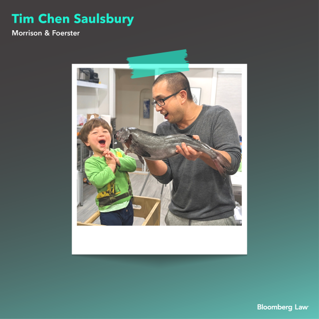 Tim Chen Saulsbury amuses his son with a fish.