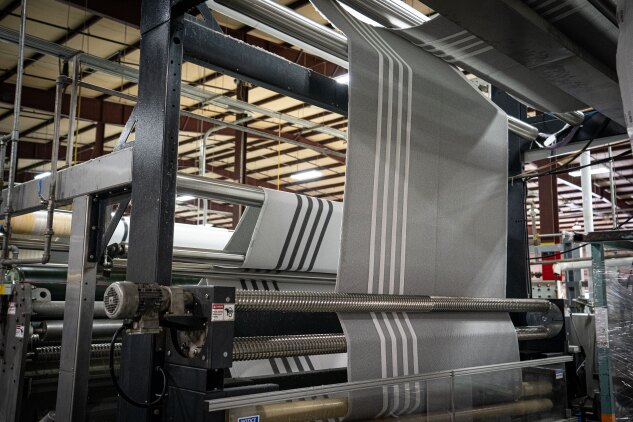 A pad processing machine at Beverly Knits. 