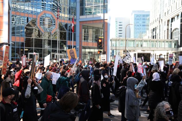 Demonstrators march outside the Hennepin County Government Center in Minneapolis on March 8. 