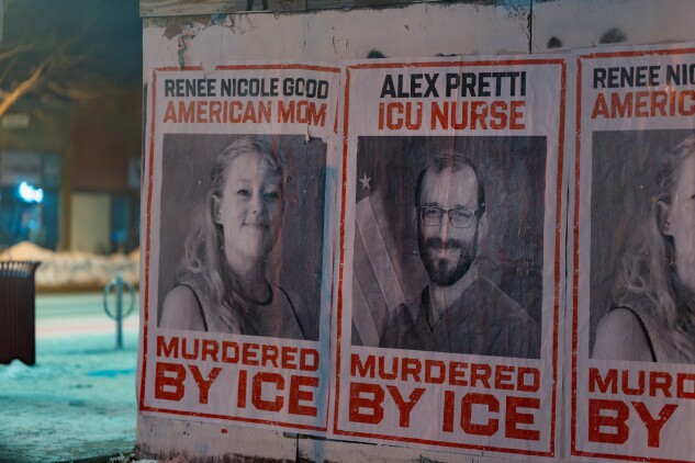 Posters depicting images of shooting victims Renee Good and Alex Pretti along Lake Street in Minneapolis.  g