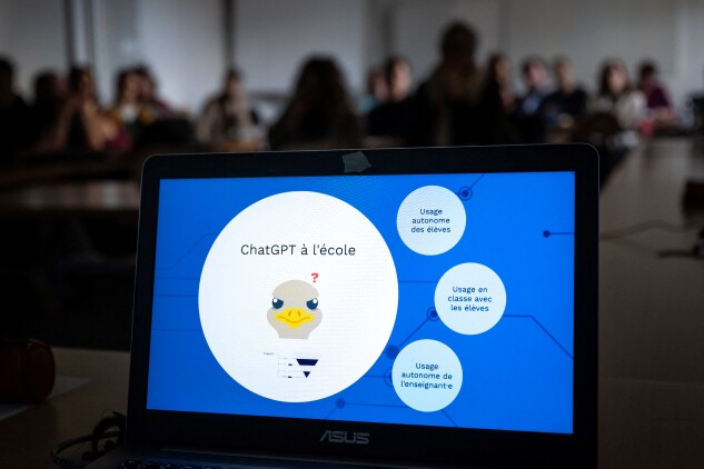 Teachers are seen behind a laptop during a workshop on ChatGPT in Geneva on Feb. 1.