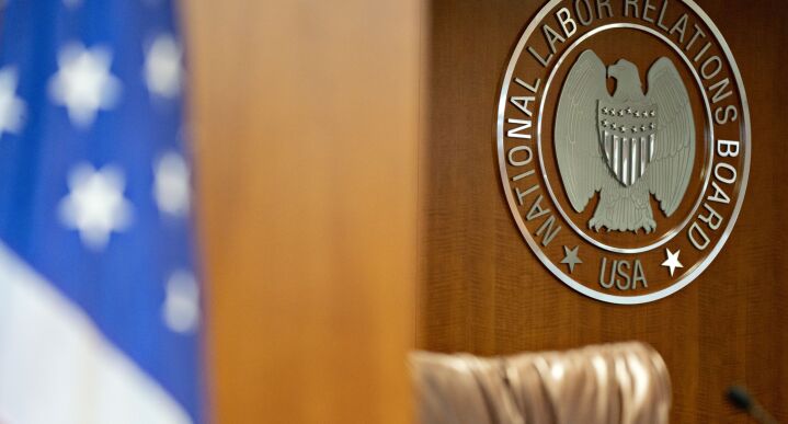 The National Labor Relations Board (NLRB) seal hangs inside a hearing room at the headquarters in Washington, on Sept. 30, 2019.