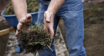 Landscaper removes the front grass lawn of a home. The U.S. Citizenship and Immigration Services announced that the allotment of seasonal guestworker visas has run out for the spring and summer.