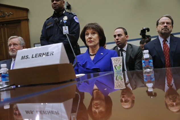 Former IRS official Lois Lerner, center, testifies during the IRS investigation before the House Oversight and Government Reform Committee March 5, 2014.