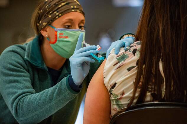 A medical worker administers the Johnson and Johnson Covid-19 vaccine to the public at a FEMA-run mobile Covid-19 vaccination clinic in Bidderford, Maine, on April 26, 2021.