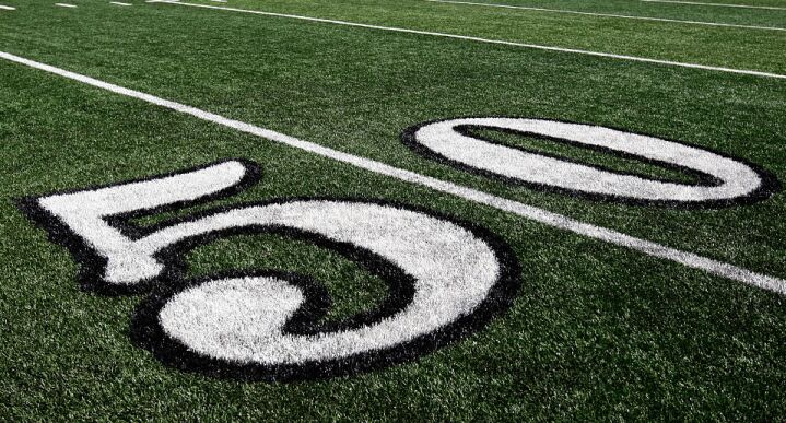 50-yard line at football stadium Insights - This is the 50-yard line marker in Rice Eccles Stadium in Salt Lake City, Utah.