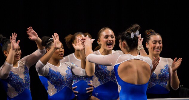 Savannah Schoenherr celebrates with her University of Florida teammates during the 2023 NCAA women's gymnastics semifinals. Schoenherr received a $3,000 check from a company she'd arranged an NIL deal with but after she deposited it, the check bounced.