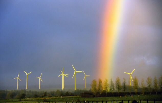 A rainbow is seen above wind turbines on March 4, 2014, in Lisbourg.