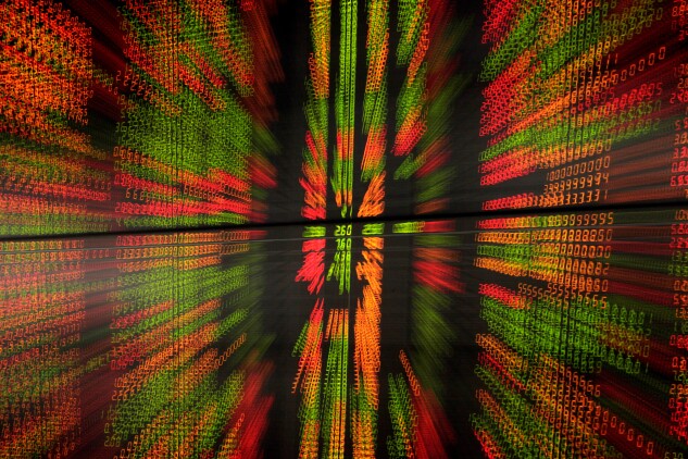 Stocks prices displayed on an electronic stock board at the Asia Plus Securities Pcl headquarters are photographed with a zoom effect in Bangkok, Thailand, on Friday, Aug. 30, 2013.