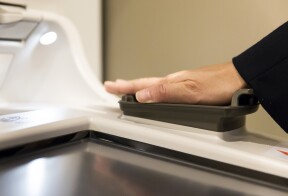 Finger-vein biometric authentication scanner at an ATM.