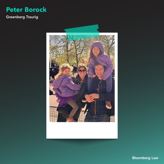 Peter, his wife, Elana, and their two daughters watching the changing of the guard in London.