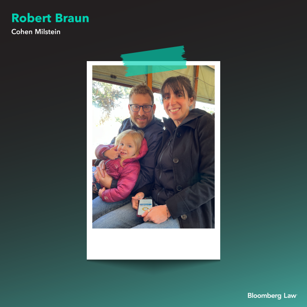 Robert Braun of Cohen Milstein and wife riding a streetcar on St. Charles Avenue in New Orleans with their younger daughter.