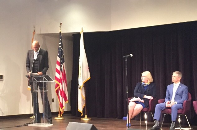 Kareem Abdul-Jabbar speaks in Washington on July 27 at the 2018 National Trademark Exposition at the National Museum of American History in Washington. Seated are PTO Director Andrei Iancu and Trademarks Commissioner Mary Boney Denison.