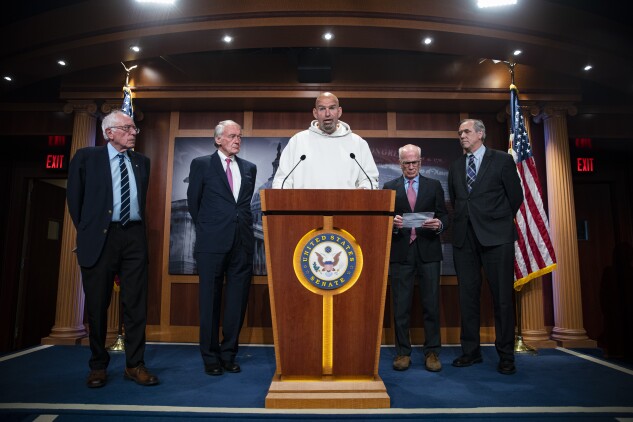 Sens. Bernie Sanders (I-Vt.)  Ed Markey (D-Mass.), John Fetterman (D-Pa), Peter Welch (D-Vt.)  Jeff Merkley (D-Ore.) hold a news conference at the Capitol on May 18, 2023. 
