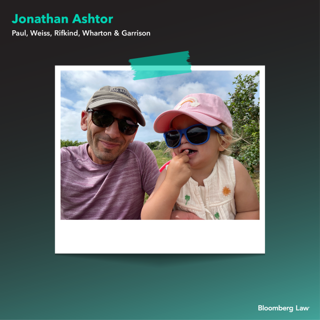Jonathan Ashtor of Paul, Weiss and middle child, 2, berry picking.