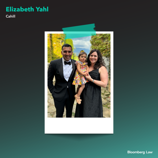 Elizabeth Yahl of Cahill, her husband, Ashrae, and their daughter at a wedding.