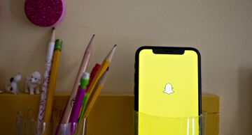 Photo of the Snap Inc. Snapchat application displayed on an Apple Inc. iPhone.
