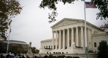 People gather outside the U.S. Supreme Court in Washington, on Nov. 12, 2019.