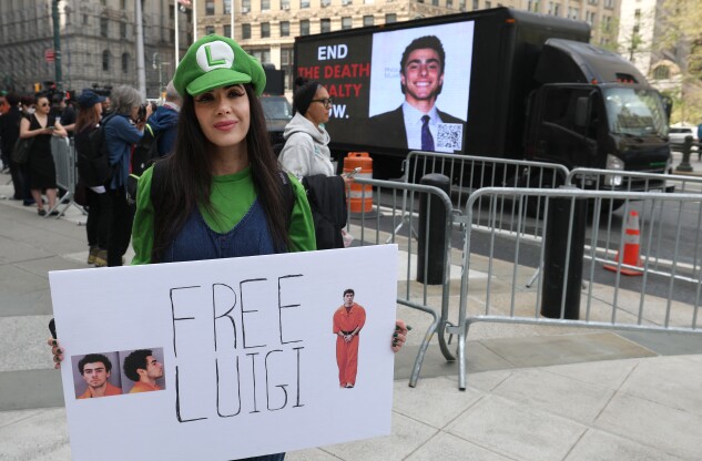 A supporters of Luigi Mangione outside Manhattan Federal Court on April 25, 2025. Mangione is accused of killing United Healthcare CEO Brian Thompson. 